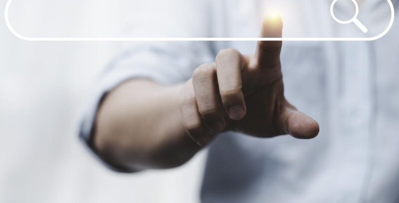 hand-touching-with-search-icon-search-engine-optimisation-seo-concept-find-information-by-internet-connection